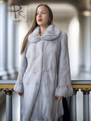 Light gray mink coat with petal-style collar, buttonless front, long sleeves and textured finish.