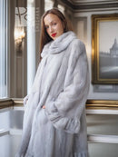 Light gray mink fur coat with petal collar and sculpted hem