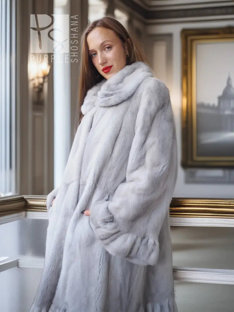 Light gray mink fur coat with petal collar and sculpted hem