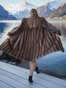 Dark brown fur hooded coat, back view with flared hem and hood down