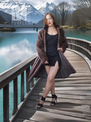 Brown fur hooded coat over black top, mid-thigh length with side pockets