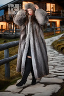 Gray fur coat with plush hood and wide sleeves, worn over black boots