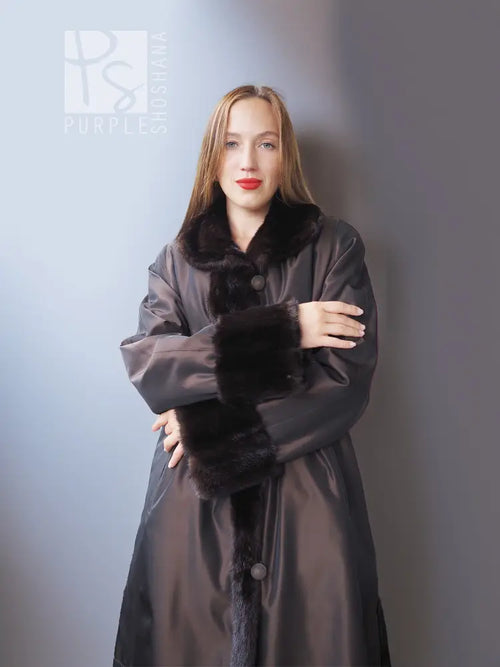 Reversible mink jacket with dark fur collar and cuffs over a dark satin outer layer