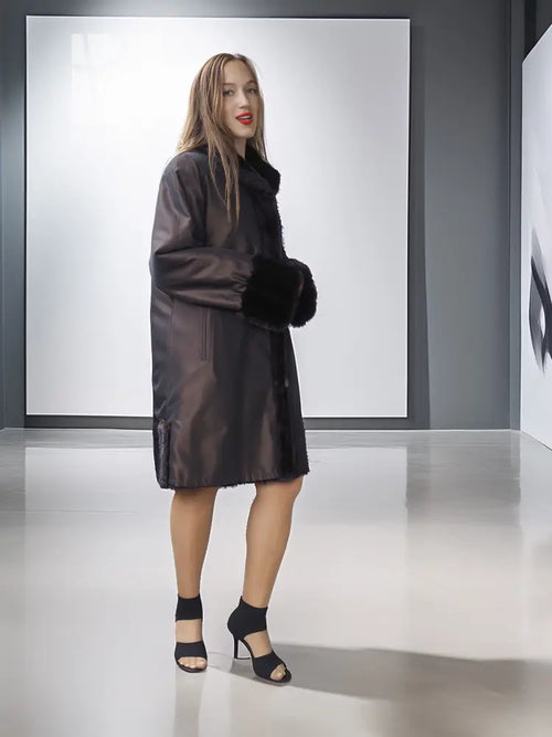 Reversible mink jacket with dark satin outer and dark fur collar and cuff accents