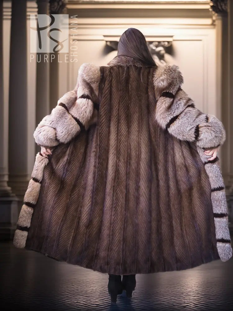 Back view of full-length striped mink fur coat with hood and voluminous sleeves