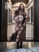 Front view of full-length striped mink fur coat with hood, wide collar, and cropped cuffs