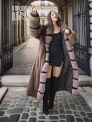 Full-length mink fur coat with hood and striped pattern, front view in a hallway setting
