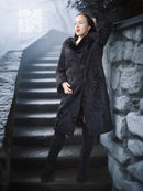 Dark lamb fur coat with fur collar and button placket, standing side profile