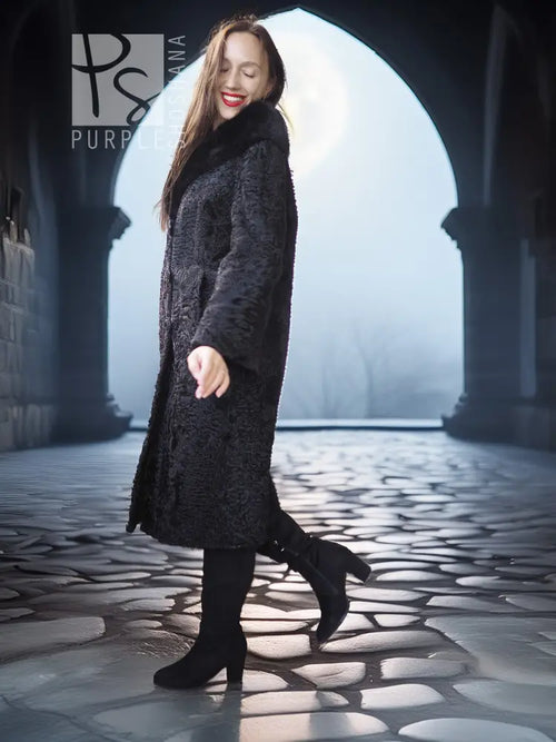 Dark lamb fur coat with fur collar, standing in profile with long hem flare