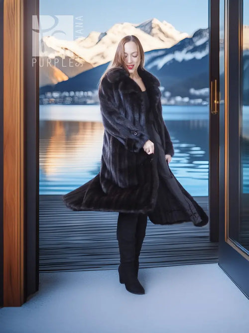 Black mink long coat with flared hem and beret, styled with dark leggings and boots