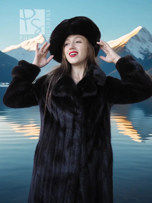 Black mink coat ensemble with beret, long fur coat, hands raised in a relaxed pose