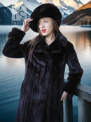 Black mink hooded beret-style hat and long coat with thick fur collar