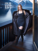 Black mink coat ensemble with beret, long fur coat worn over a dark dress, standing