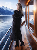 Black mink coat with thick collar and matching beret, full-length view