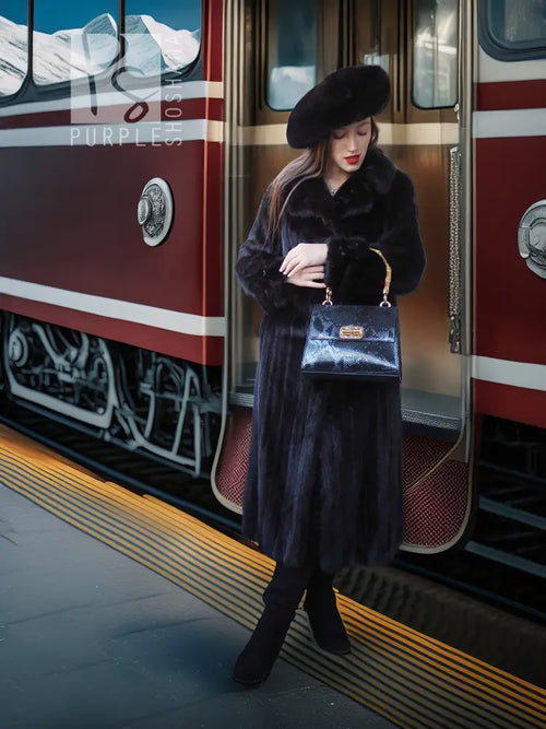 Black mink coat ensemble with matching beret, back slit, and long sleeves