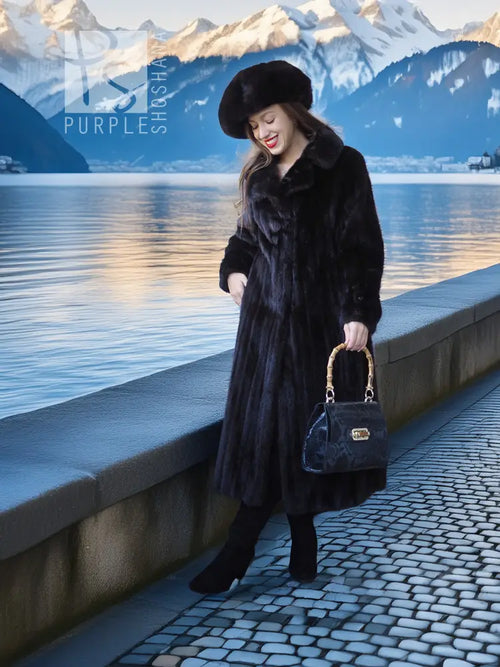 Black mink coat ensemble with beret, long dark fur coat, holding a black handbag outdoors