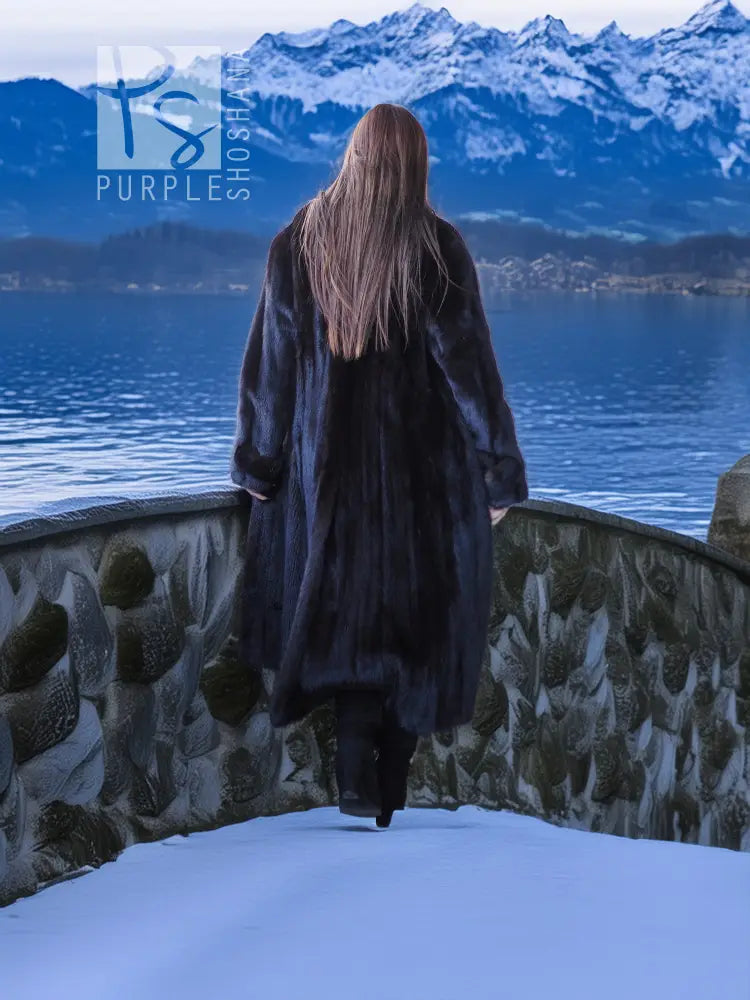 Black mink long coat with flowing back hem, worn with a matching beret