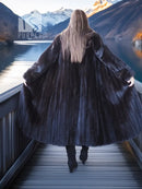 Black mink coat from behind with full, flared skirt and matching beret