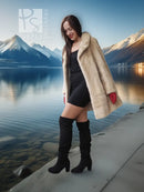 Cream mink fur coat over black dress, red gloves, black knee boots