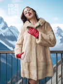 Cream faux mink fur coat with red inner cuffs, collar up and buttoned front
