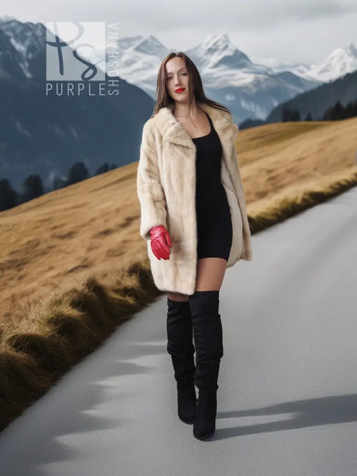 Light beige mink fur coat with open front and red fingerless gloves