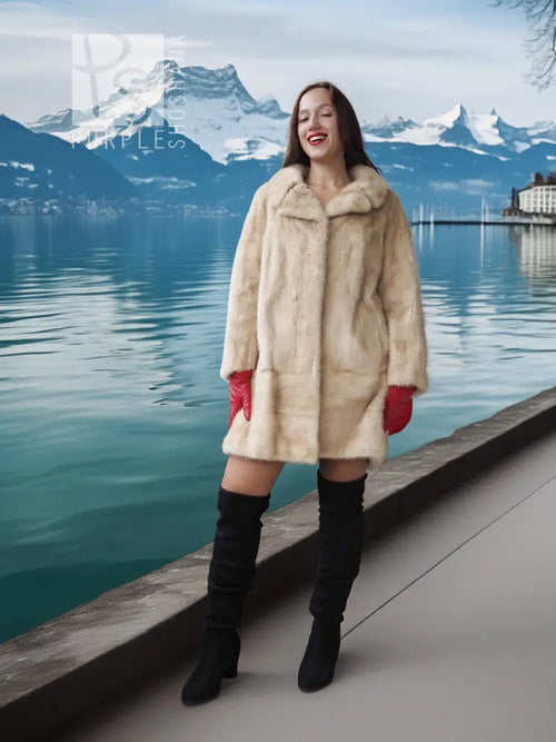 Light beige mink fur coat with stand collar and red gloves, long sleeves