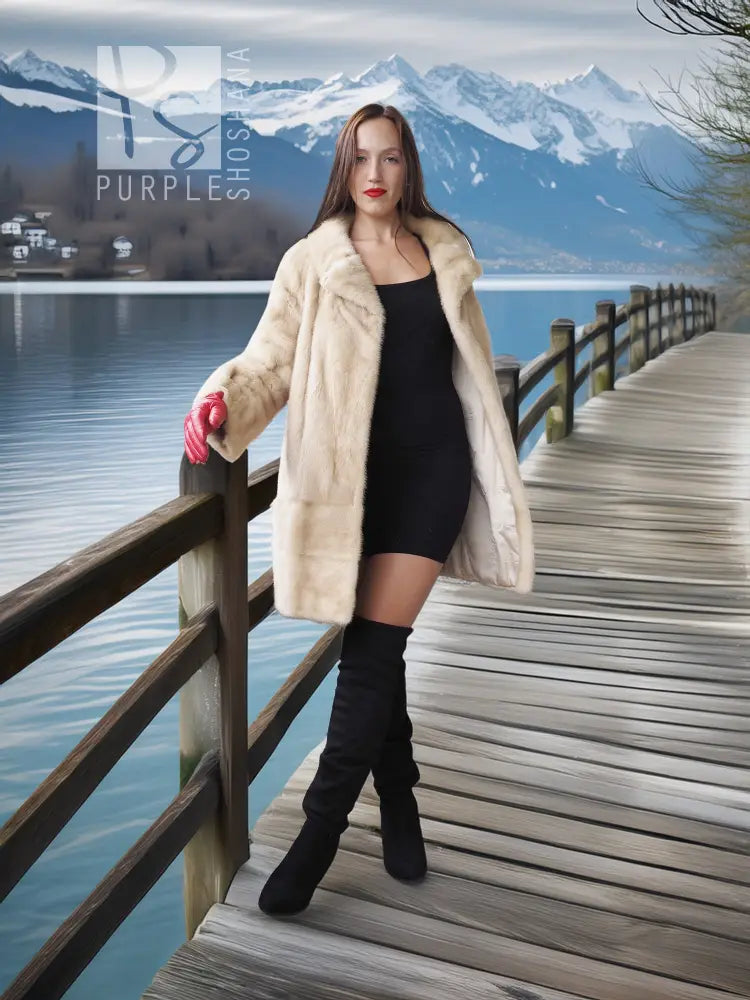 Light beige mink fur coat, open front, paired with black mini dress and red gloves