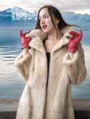 Cream mink fur coat with red gloves, open collar, close-up
