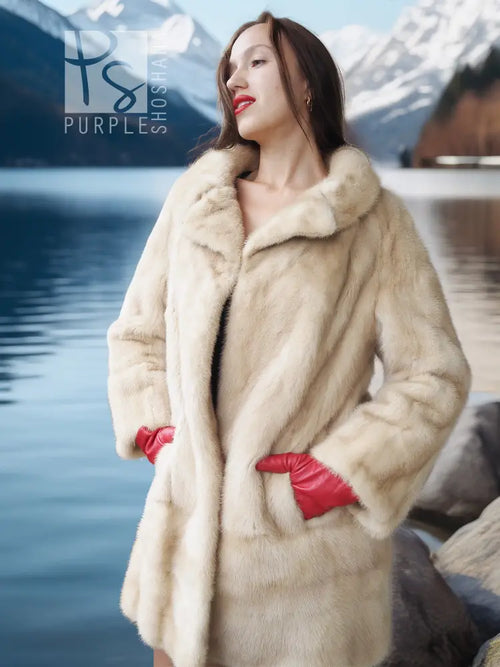 Cream mink fur coat with open front, red gloves, standing pose