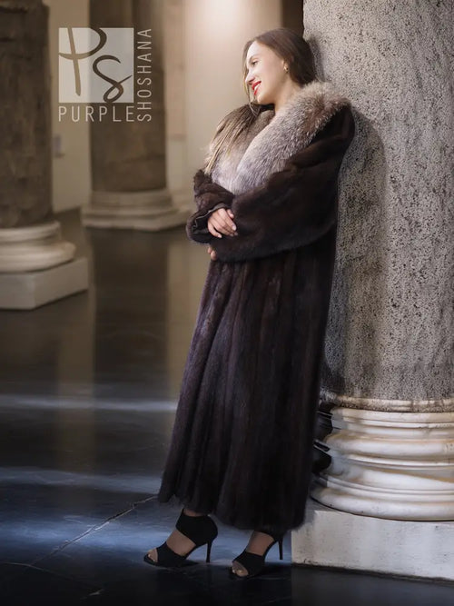 Vintage mink fur coat with pale fox-fur collar, arm-crossed side view, long length.