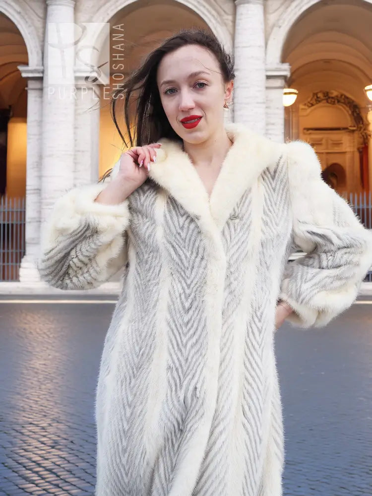 Cream chevron mink coat close-up with plush collar and long textured chevron front