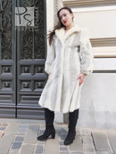 Full-length cream chevron mink coat with wide collar and textured chevron panels