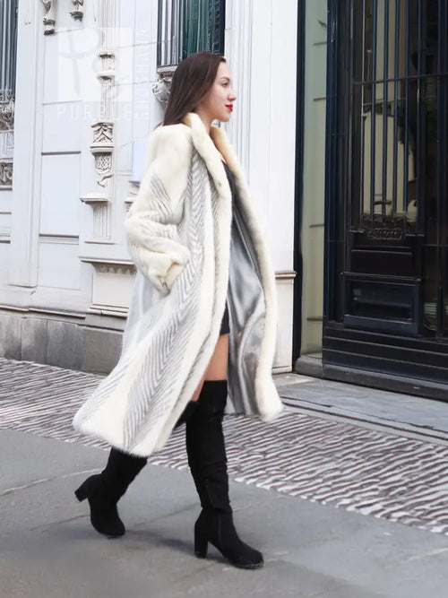 Full-length mink coat in light cream with chevron herringbone texture, side drape
