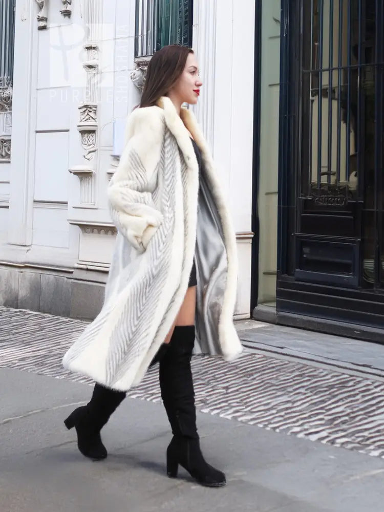 Full-length mink coat in light cream with chevron herringbone texture, side drape
