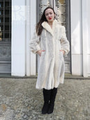 Full-length mink coat in light cream with chevron herringbone pattern and wide fur collar