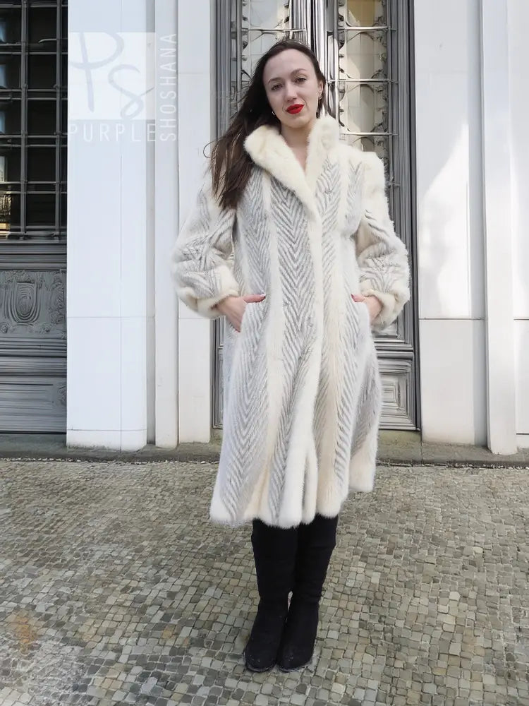 Full-length mink coat in light cream with chevron herringbone pattern and wide fur collar