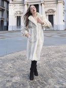 Cream chevron mink coat with fluffy collar and long sleeves, relaxed fit