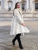 Full-length cream chevron mink coat with bold herringbone texture
