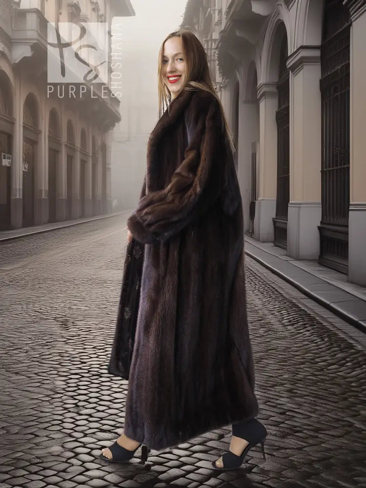 Long mahogany mink fur coat with wrap-style front and wide collar, full-length hem