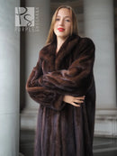 Long mahogany mink fur coat with wide shawl collar and belted waist, full sleeves