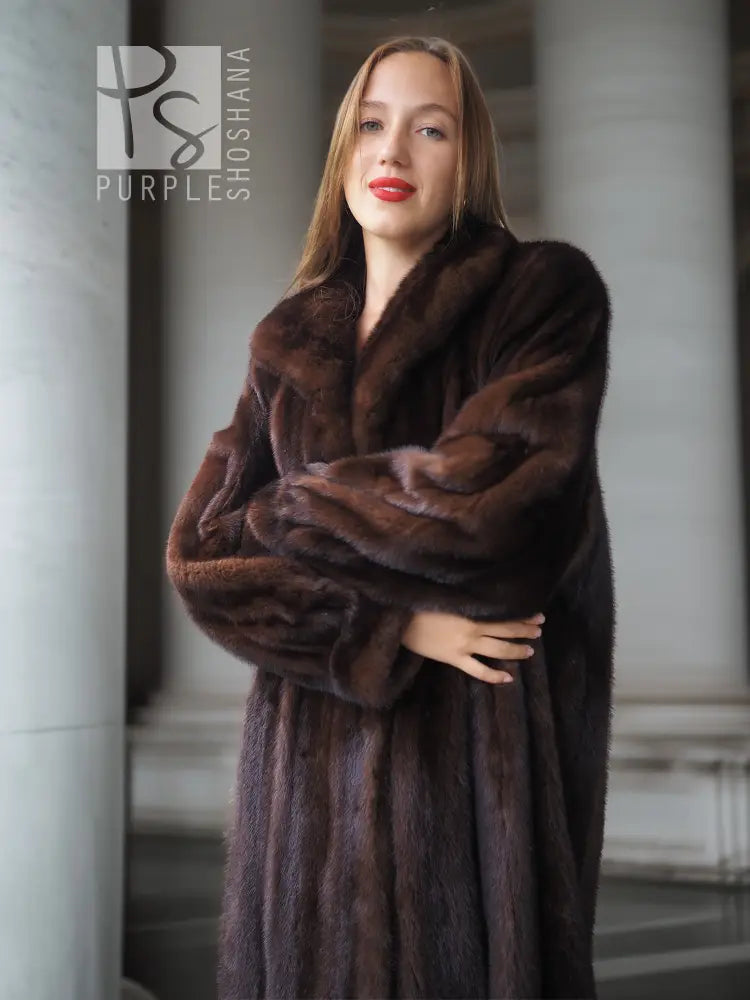 Long mahogany mink fur coat with wide shawl collar and belted waist, full sleeves