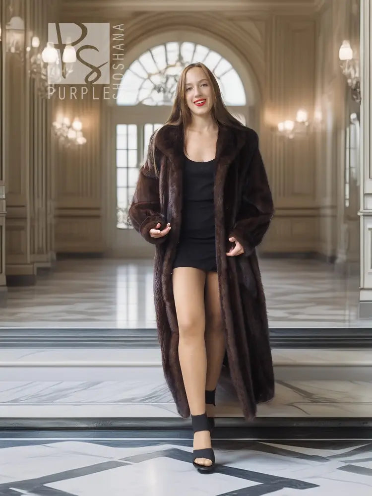 Long mink fur coat in dark brown over black dress, front view