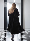 Reversible sheared mink coat, long black silhouette with button front and swing hem