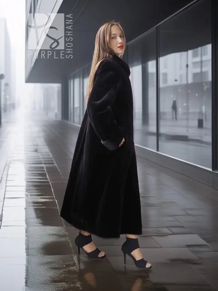 Reversible sheared mink coat in dark black with button-front and standing collar, side walking pose.
