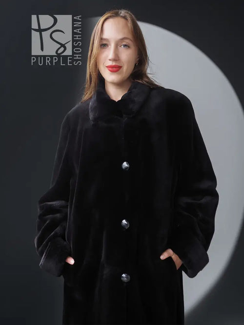 Black mink coat with button placket and stand collar, long sleeves