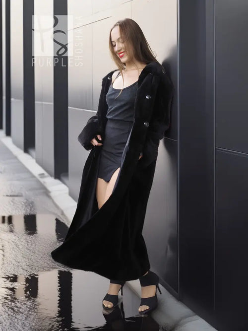 Black mink coat with open front and side slit, draped long hem