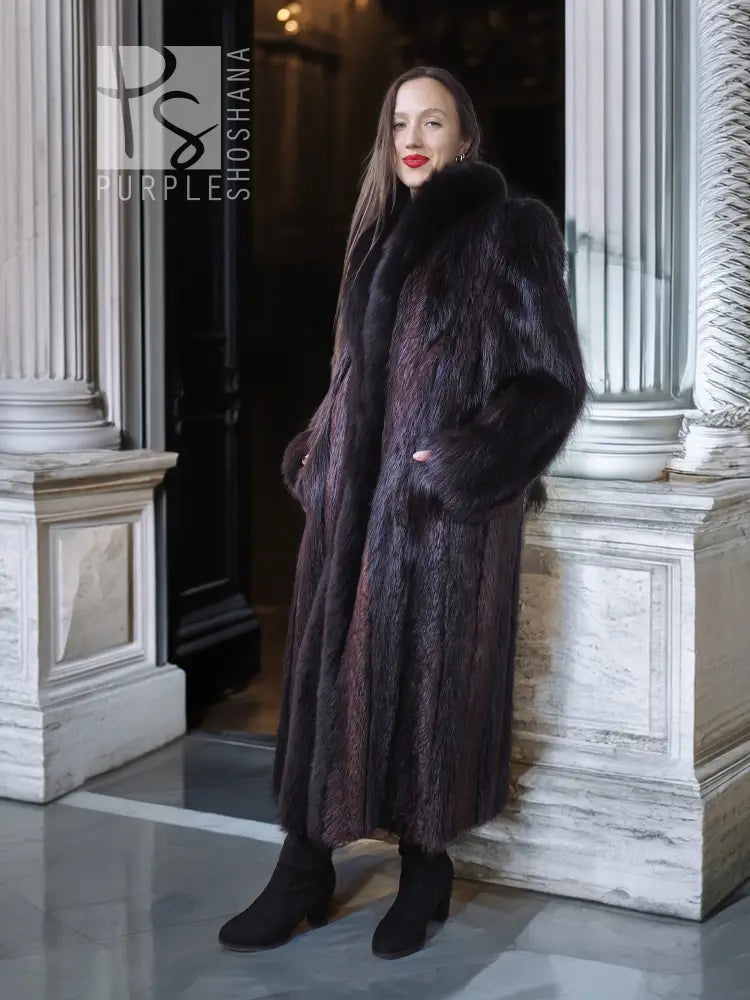Long beaver fur coat with dark fox-fur trim, long sleeves and button front.