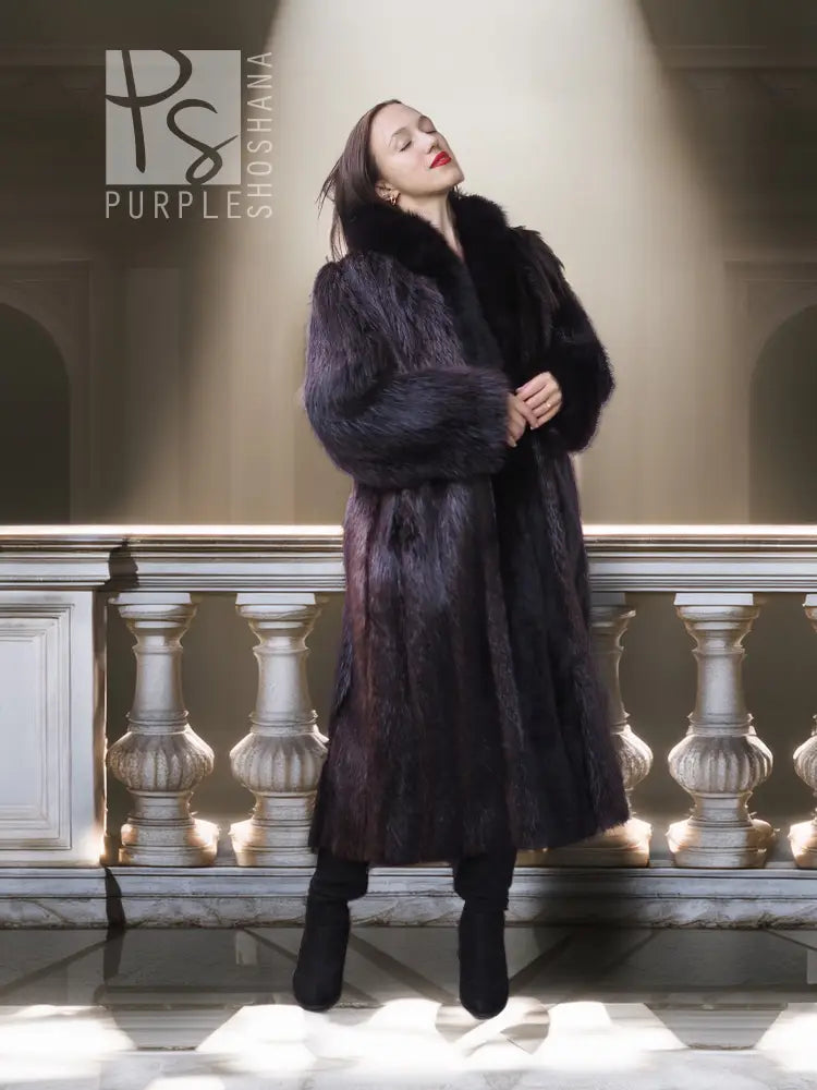 Standing view of a long dark fur coat with thick collar and open front