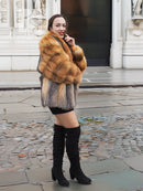 Two-tone fox fur jacket with orange sleeves and grey panels, short hem