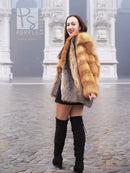 Orange and grey fur jacket with wide collar and textured plaid pattern.
